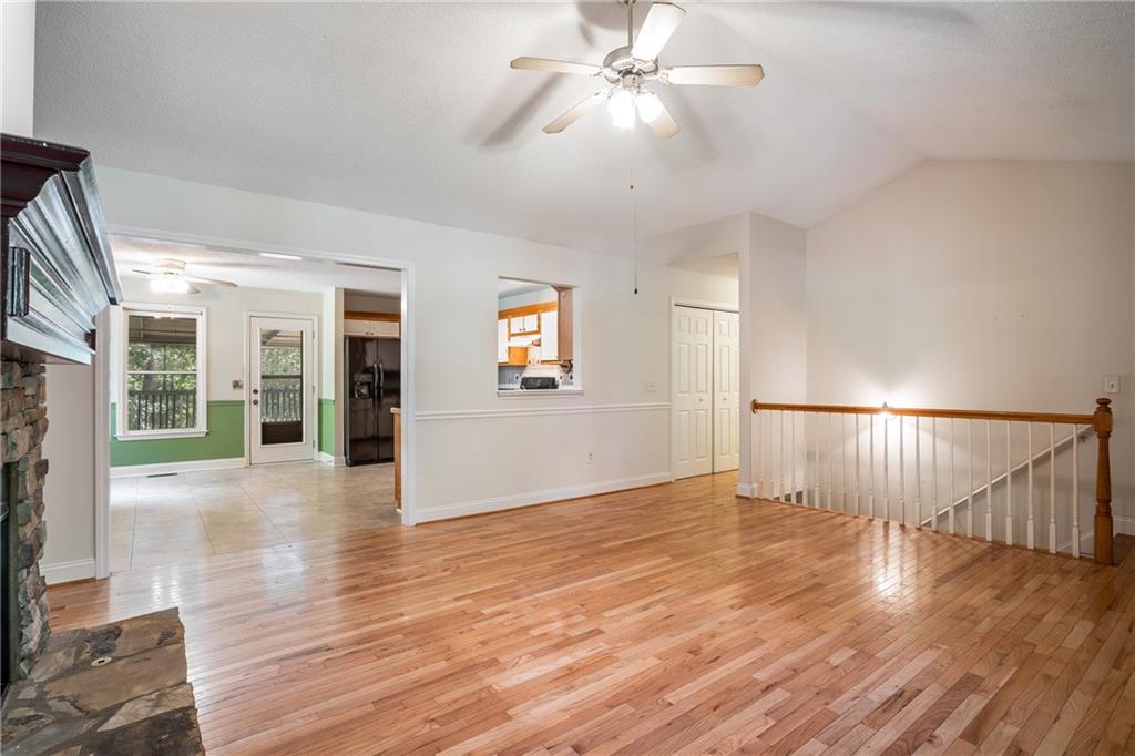 90 Chimney Sweep Trail Fairmount, GA 30139 - Photo 20 of 42 a view of an empty room with wooden floor and a fireplace