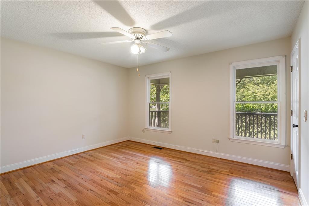 90 Chimney Sweep Trail Fairmount, GA 30139 - Photo 30 of 42 an empty room with wooden floor fan and windows