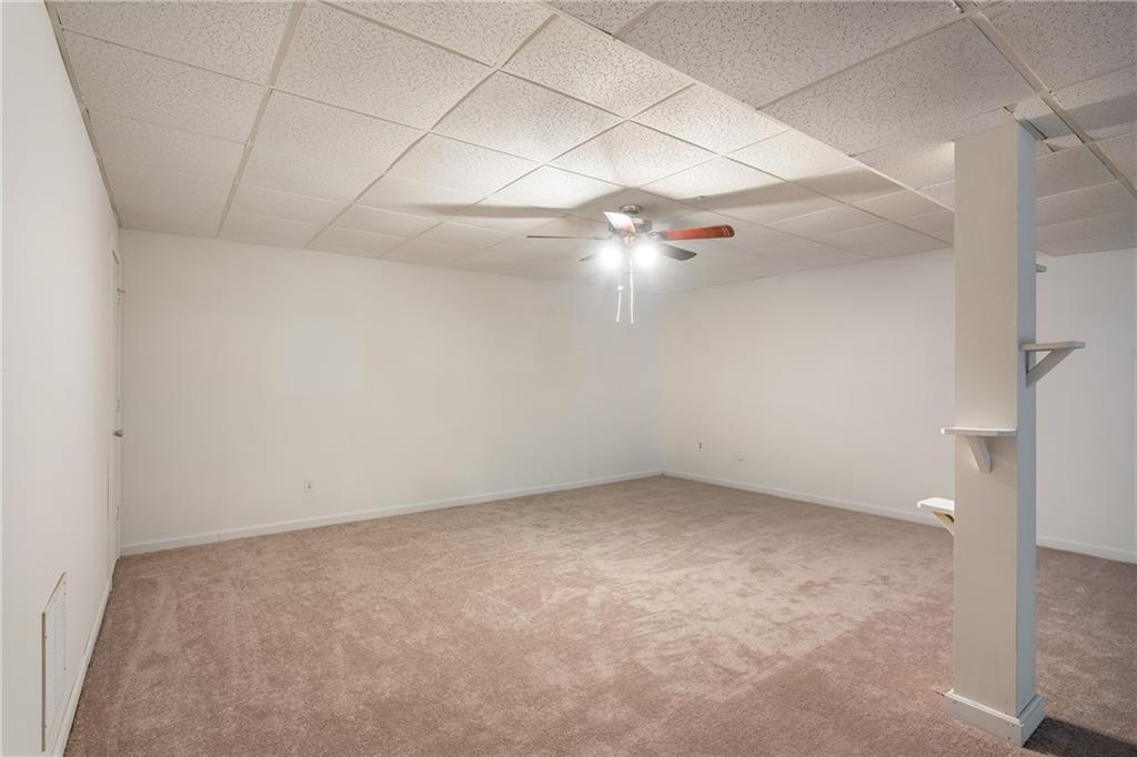 90 Chimney Sweep Trail Fairmount, GA 30139 - Photo 34 of 42 an empty room with a ceiling fan and carpet