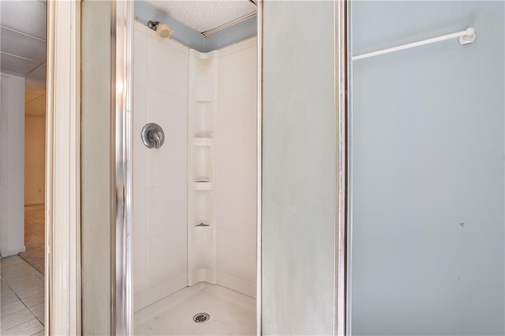 90 Chimney Sweep Trail Fairmount, GA 30139 - Photo 40 of 42 a bathroom with a glass shower door