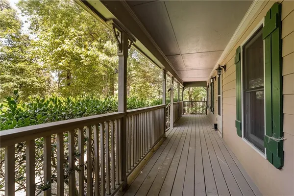 a view of a balcony with wooden floor