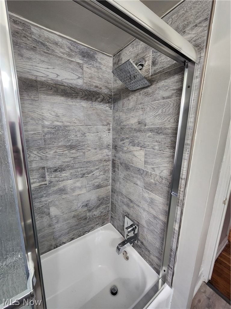 2199 North Taylor Road Cleveland Heights, OH 44112 - Photo 14 of 19 Bathroom with enclosed tub / shower combo and wood-type flooring
