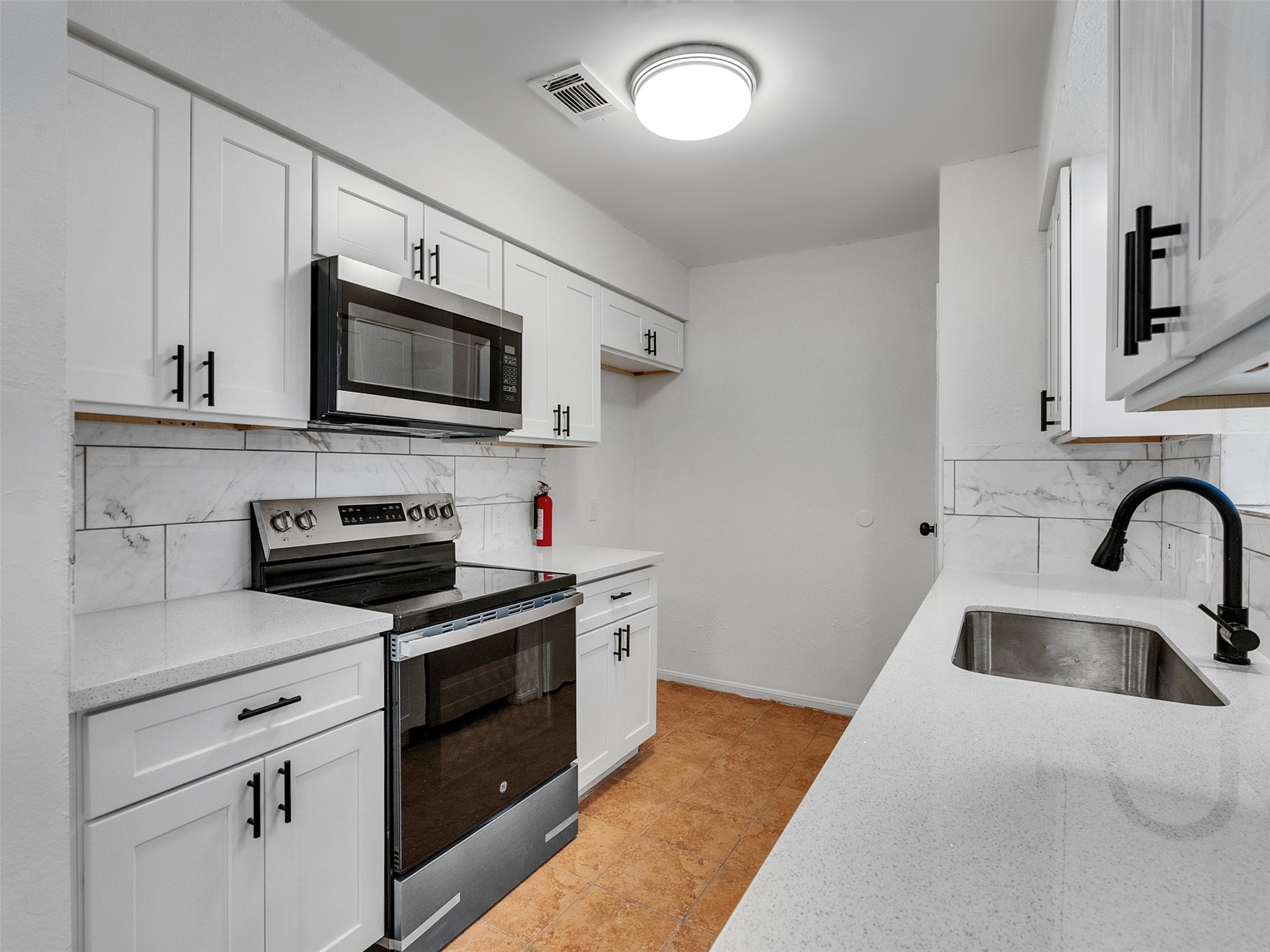3915 Brumbelow Street Rosenberg, TX 77471 - Photo 3 of 25 Brand New Stove, Microwave, and Kitchen