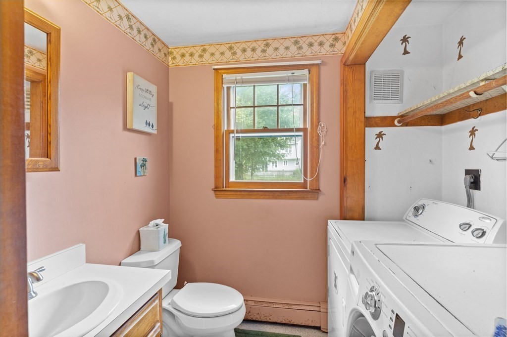 45 Leonard Road Marshfield, MA 02050 - Photo 13 of 20 a white toilet sitting next to a bathroom sink