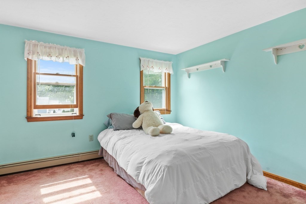 45 Leonard Road Marshfield, MA 02050 - Photo 16 of 20 a bedroom with a bed and windows