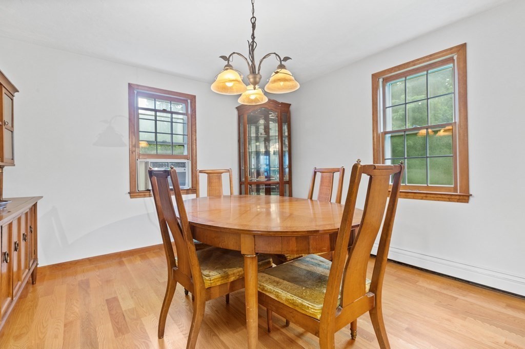 45 Leonard Road Marshfield, MA 02050 - Photo 9 of 20 a view of a dining room with furniture and a chandelier