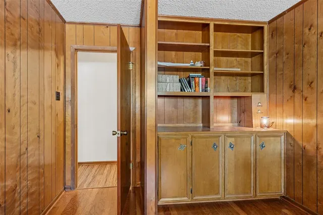 a view of walk in closet with empty room