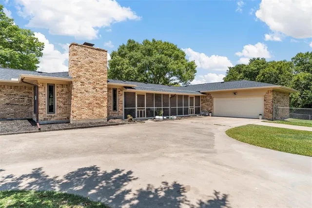 front view of a house with a garden