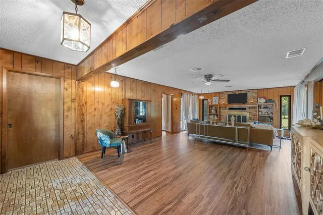 a room with wooden floors and furniture