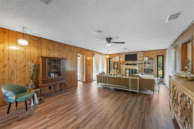a view of a living room and kitchen with a large window