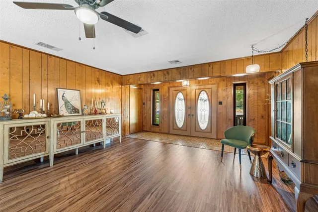 a view of an entryway with wooden floor