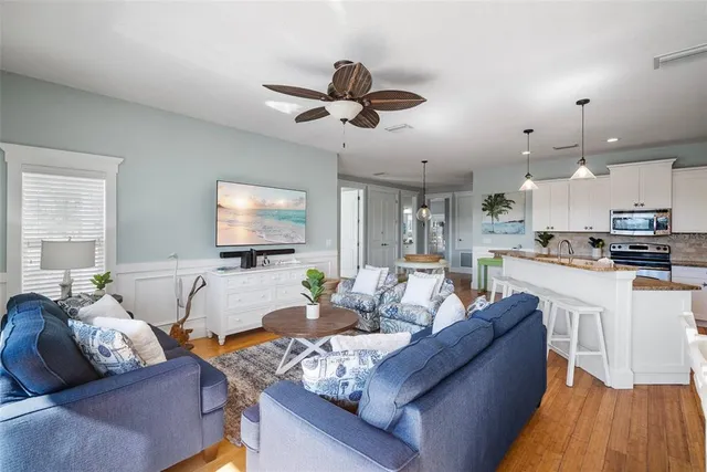 a living room with kitchen and furniture