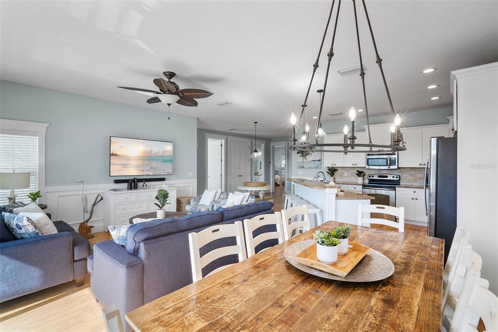 204 66th Street Holmes Beach, FL 34217 - Photo 13 of 53 a living room with kitchen and furniture