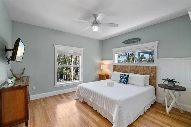 a bathroom with a double vanity sink mirror and shower