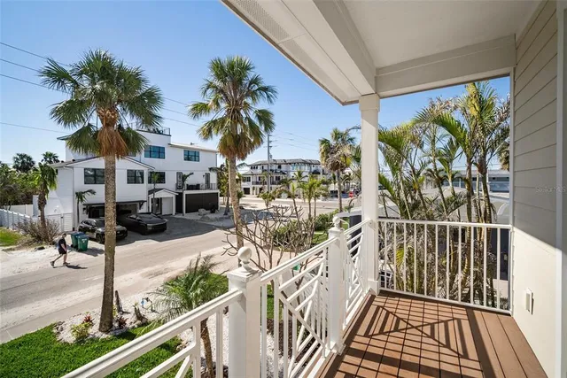 a view of a balcony with furniture