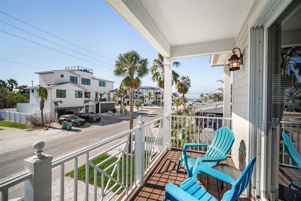 204 66th Street Holmes Beach, FL 34217 - Photo 27 of 53 a view of a balcony with furniture