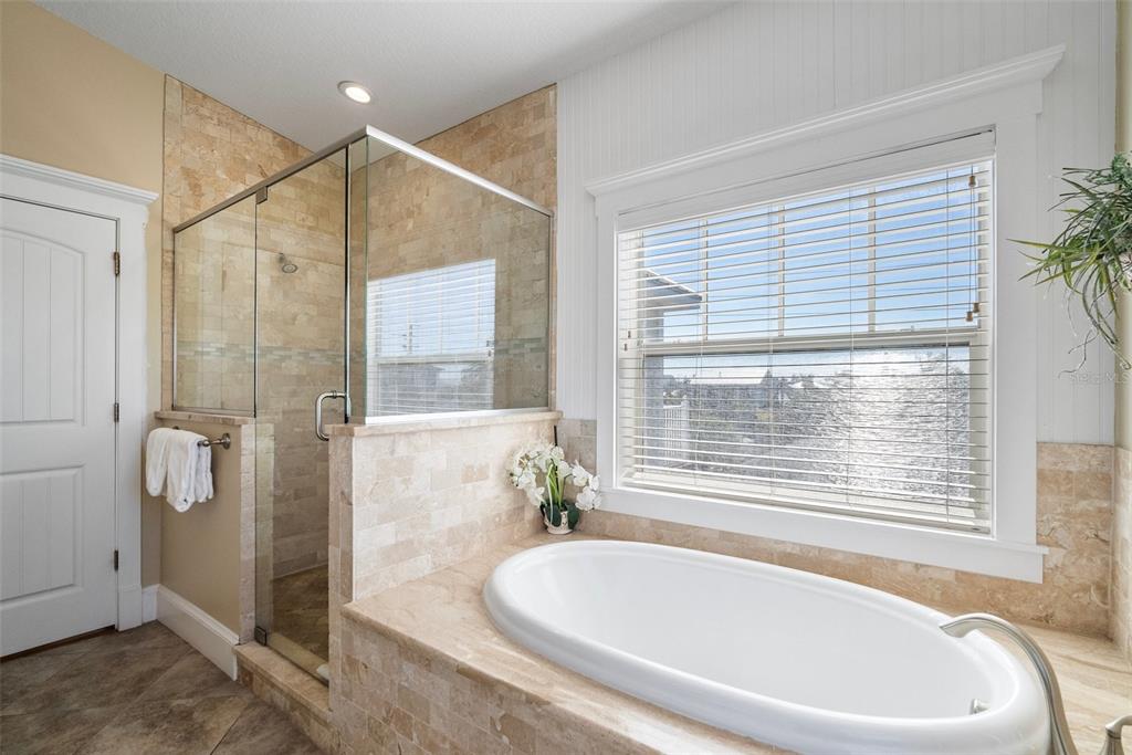 204 66th Street Holmes Beach, FL 34217 - Photo 35 of 53 a white bath tub sitting next to a window