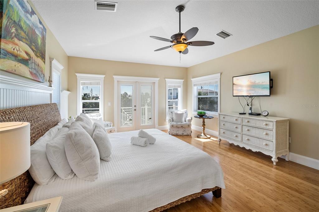 204 66th Street Holmes Beach, FL 34217 - Photo 37 of 53 a bedroom with a bed and furniture