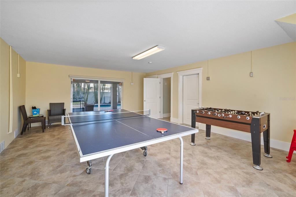 204 66th Street Holmes Beach, FL 34217 - Photo 42 of 53 a living room with furniture a rug and a table