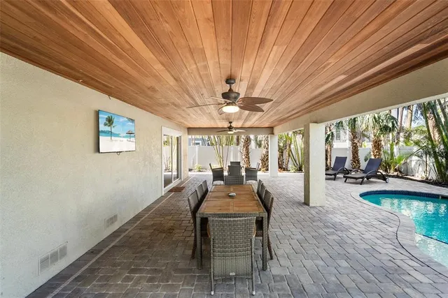 a view of a backyard with sitting area