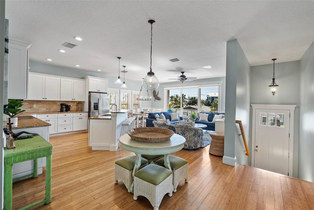 204 66th Street Holmes Beach, FL 34217 - Photo 5 of 53 a room with stainless steel appliances kitchen island granite countertop furniture and a view of kitchen