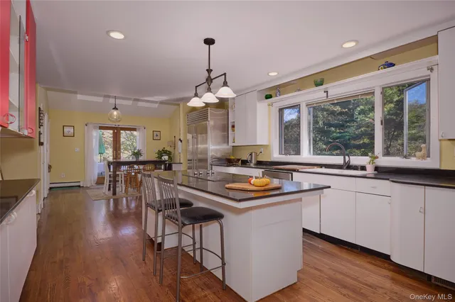 a living room with furniture window and wooden floor