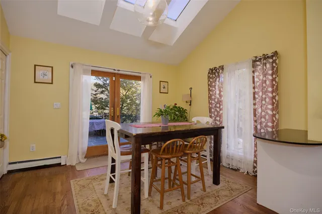 a bedroom with a bed and flat screen tv