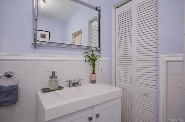 a bedroom with a bed and a cabinets