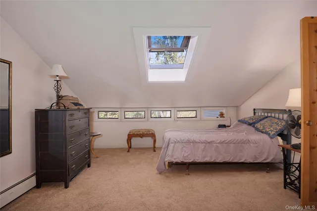 a view of a house with a backyard porch and sitting area