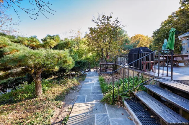 a house view with a sitting space and garden