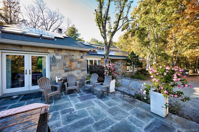 a outdoor living space with patio furniture and wooden floor