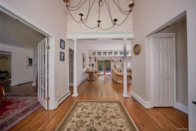 a dining room with furniture window and wooden floor
