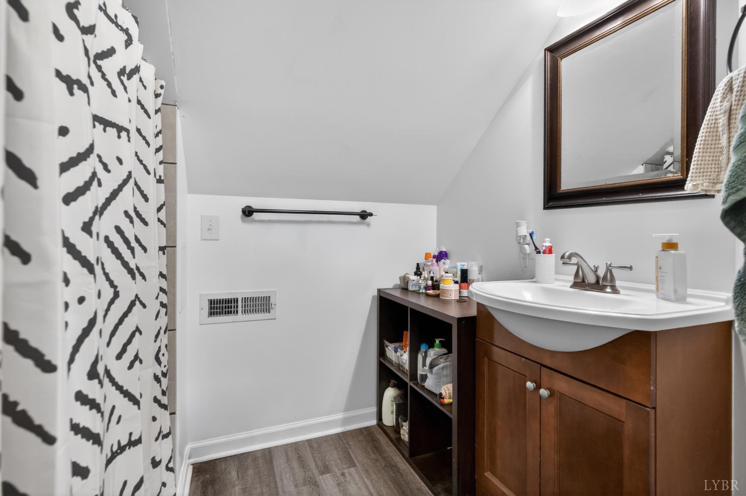 1305 Harding Street Lynchburg, VA 24502 - Photo 23 of 33 a bathroom with a sink and a mirror