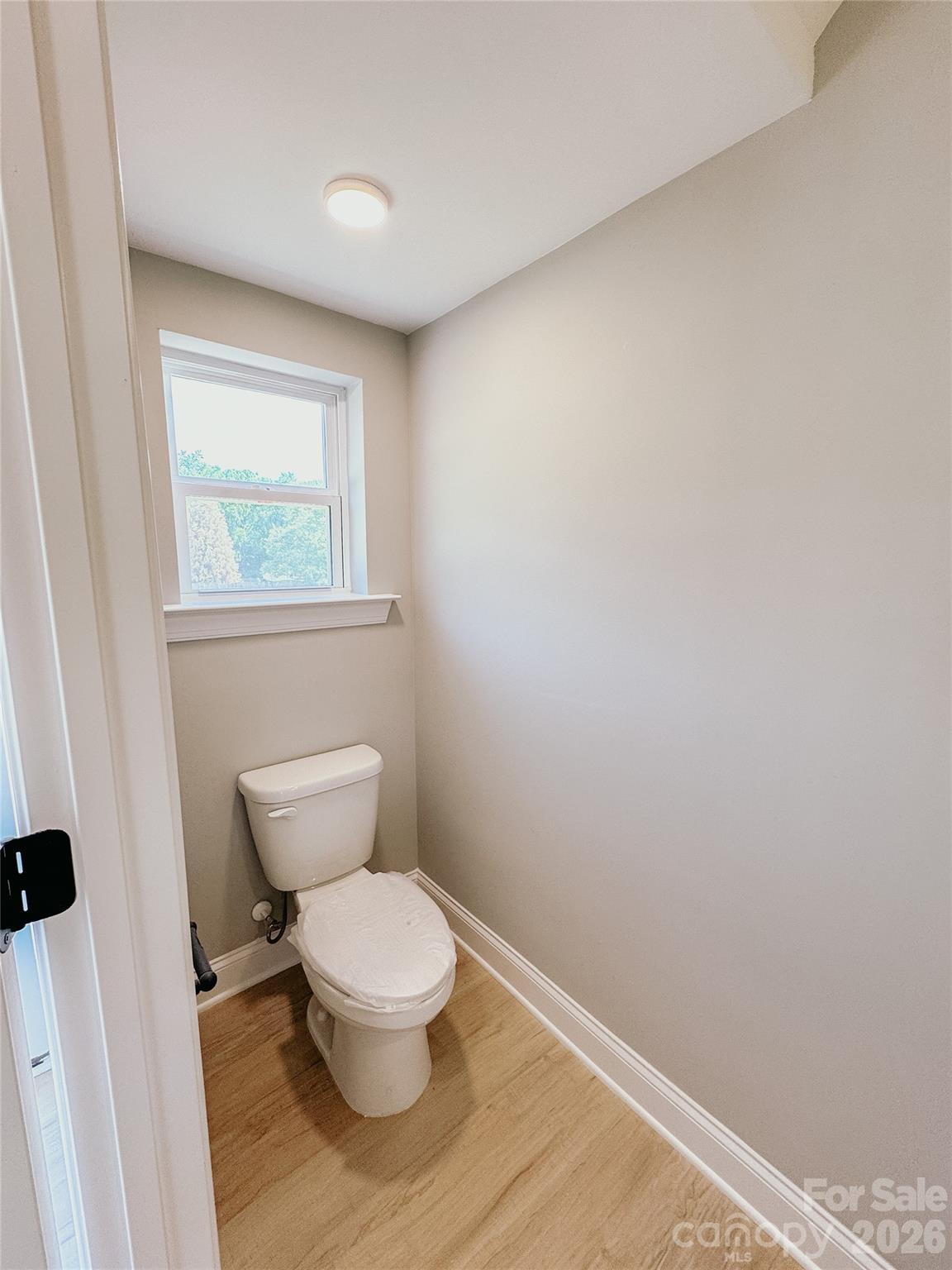 1455 West Ridge Road Salisbury, NC 28147 - Photo 13 of 26 a white toilet sitting next to a small window