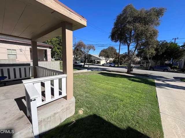 a view of an house with backyard porch and furniture