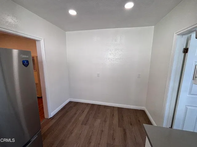 a view of small space with wooden floor