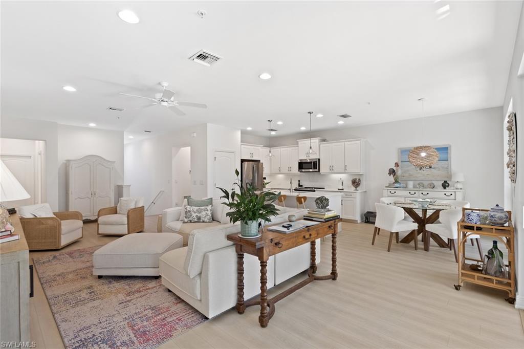 6973 Avalon Circle, Unit 1406 Naples, FL 34112 - Photo 10 of 36 Living area with light wood-type flooring, a ceiling fan, and recessed lighting