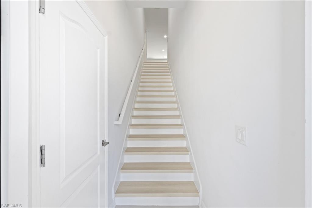 6973 Avalon Circle, Unit 1406 Naples, FL 34112 - Photo 4 of 36 View of stairs