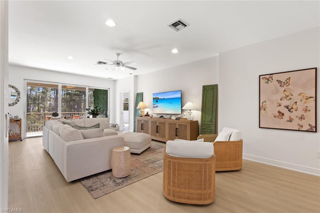 6973 Avalon Circle, Unit 1406 Naples, FL 34112 - Photo 8 of 36 Living room featuring light wood-style flooring, ceiling fan, and recessed lighting
