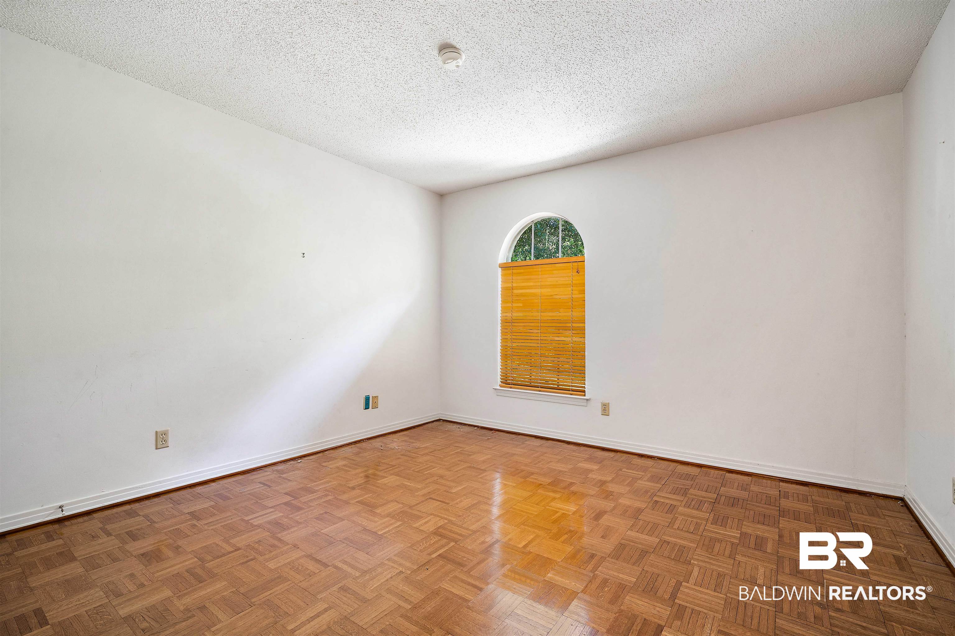 5559 Woodside Drive North Mobile, AL 36608 - Photo 11 of 28 Unfurnished room with a textured ceiling and baseboards