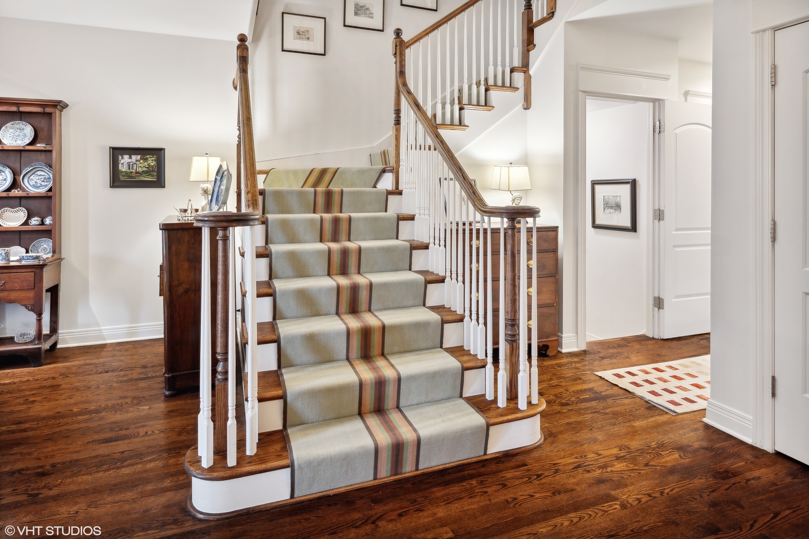 432 Fox Meadow Drive Northfield, IL 60093 - Photo 13 of 33 a view of staircase with wooden floor and a rug