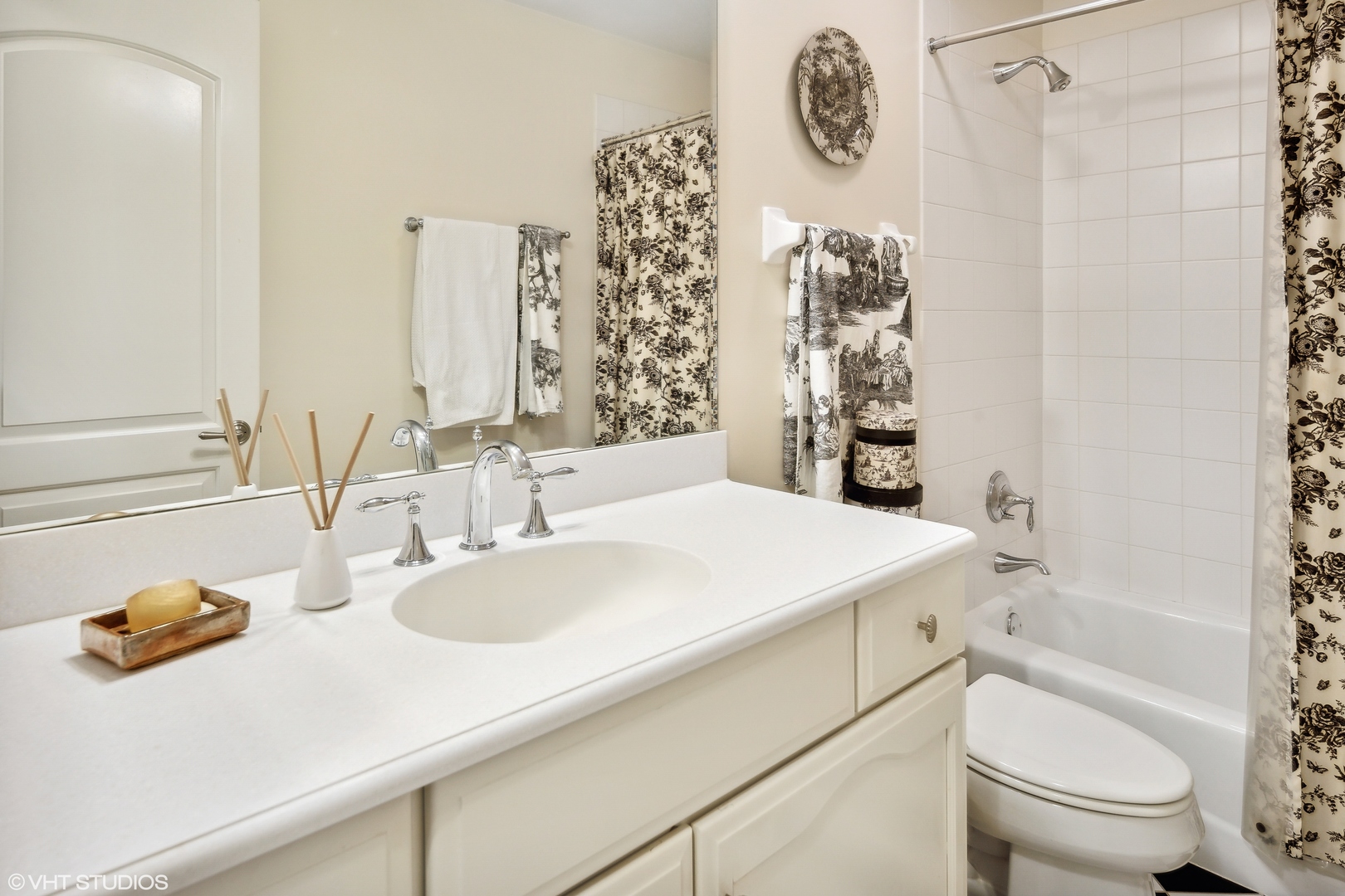 432 Fox Meadow Drive Northfield, IL 60093 - Photo 22 of 33 a bathroom with a sink a toilet and shower curtain