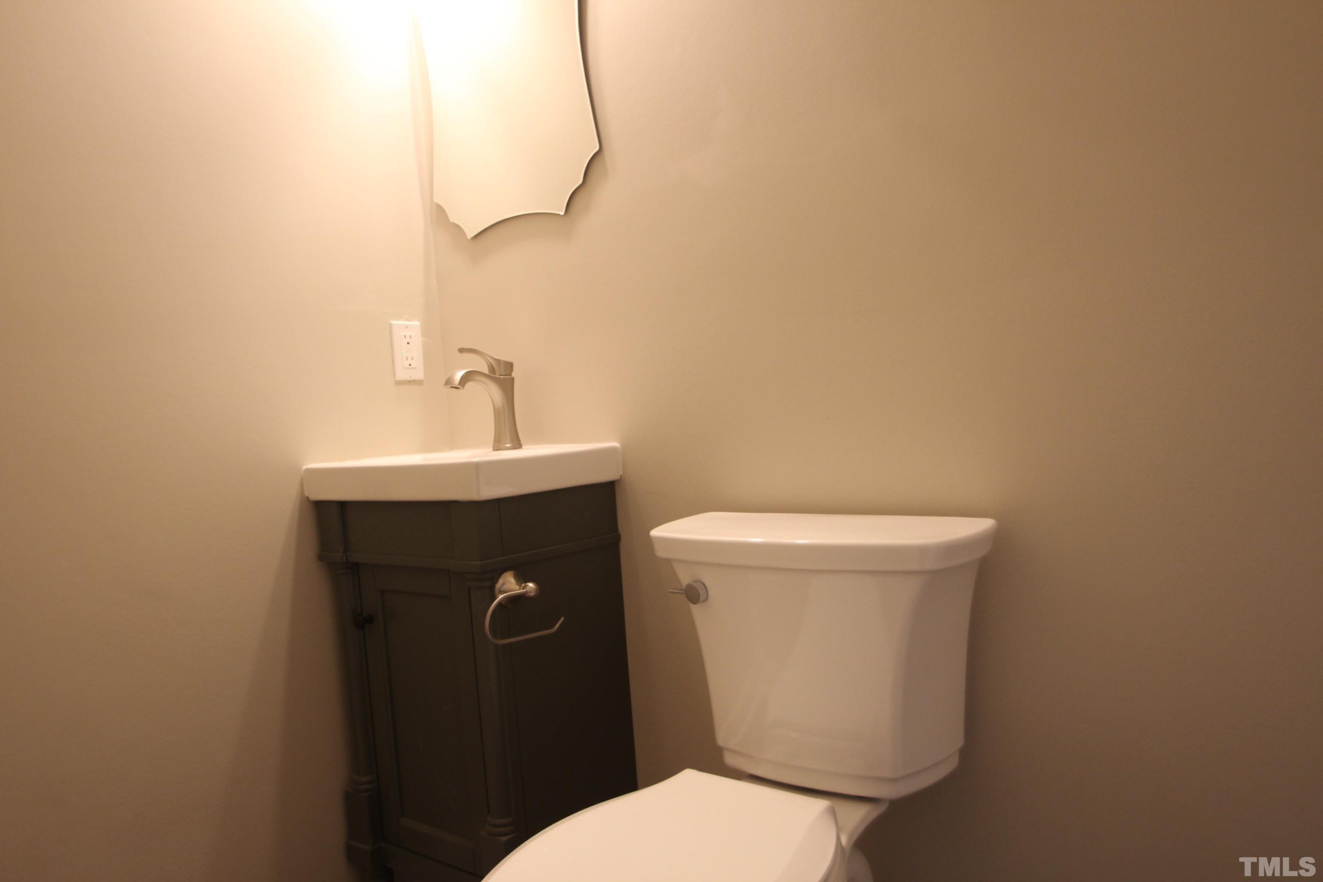 895 Oxford Road Roxboro, NC 27574 - Photo 19 of 23 a bathroom with a sink and a toilet