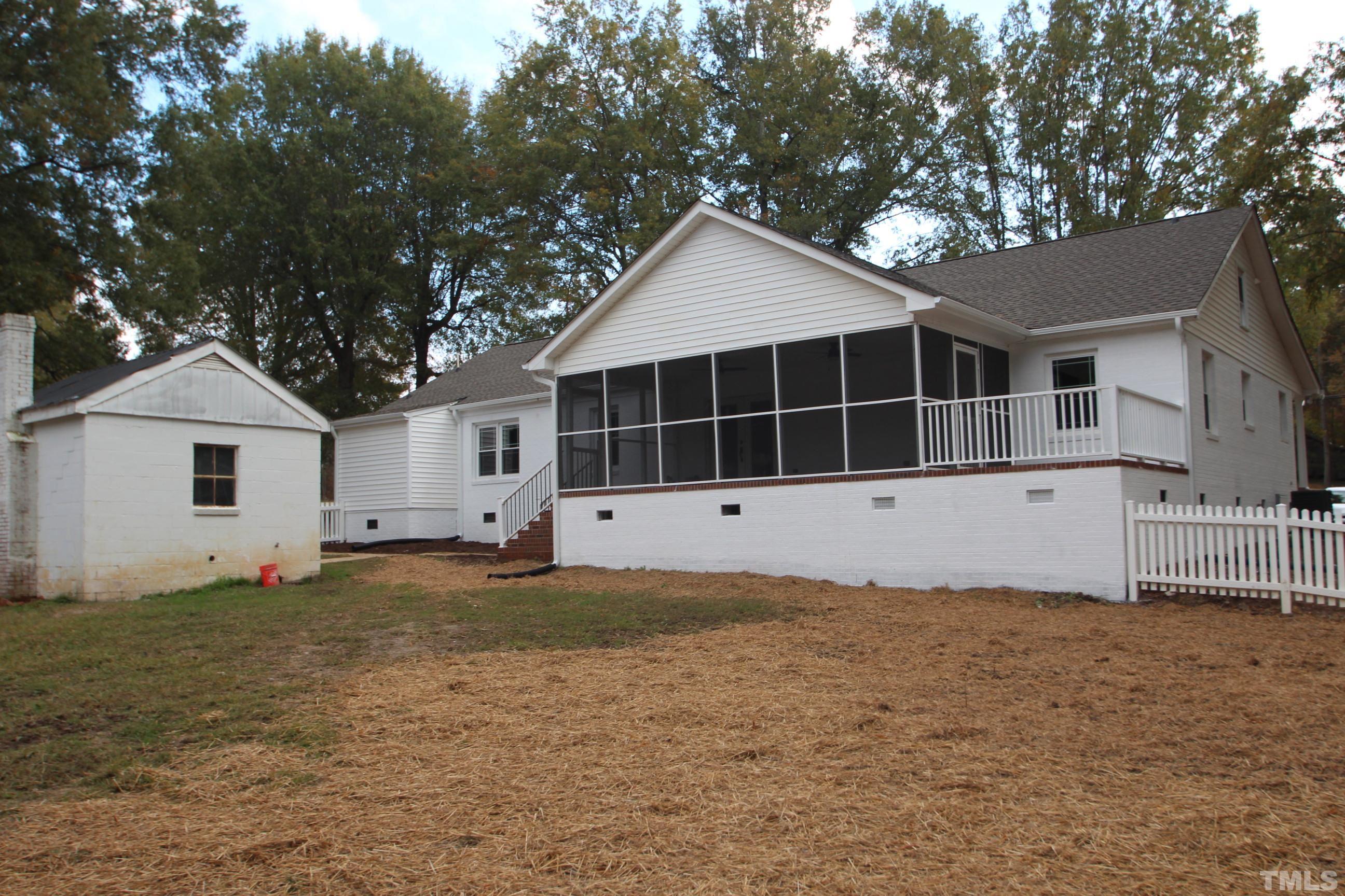 895 Oxford Road Roxboro, NC 27574 - Photo 3 of 23 a front view of a house with a yard