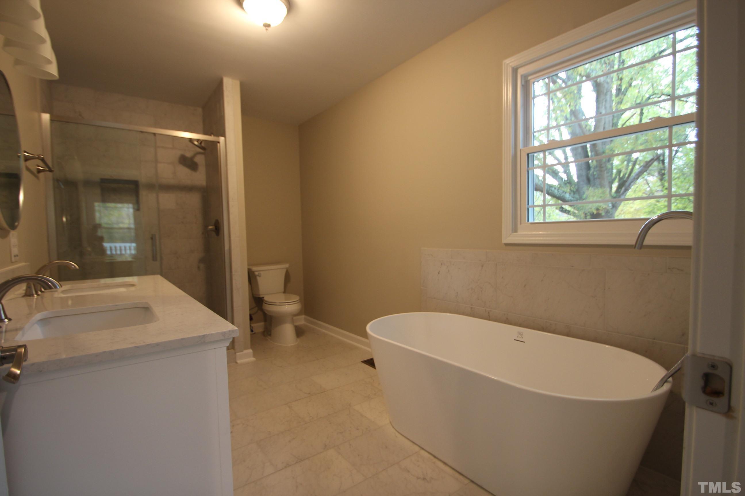 895 Oxford Road Roxboro, NC 27574 - Photo 8 of 23 a white bath tub sitting next to a white sink