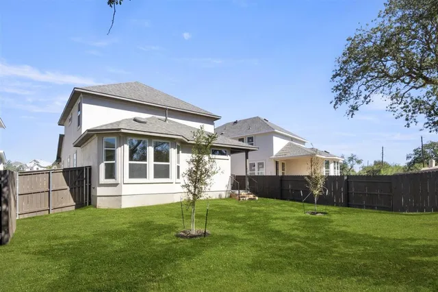 a view of a backyard with a house