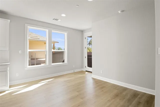a kitchen with kitchen island a sink stainless steel appliances and cabinets