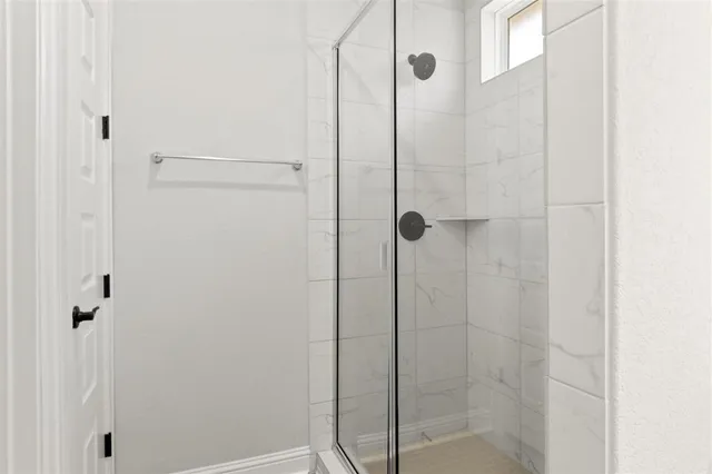 a bathroom with a double vanity sink and mirror