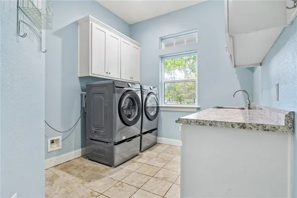 a utility room with dryer and washer