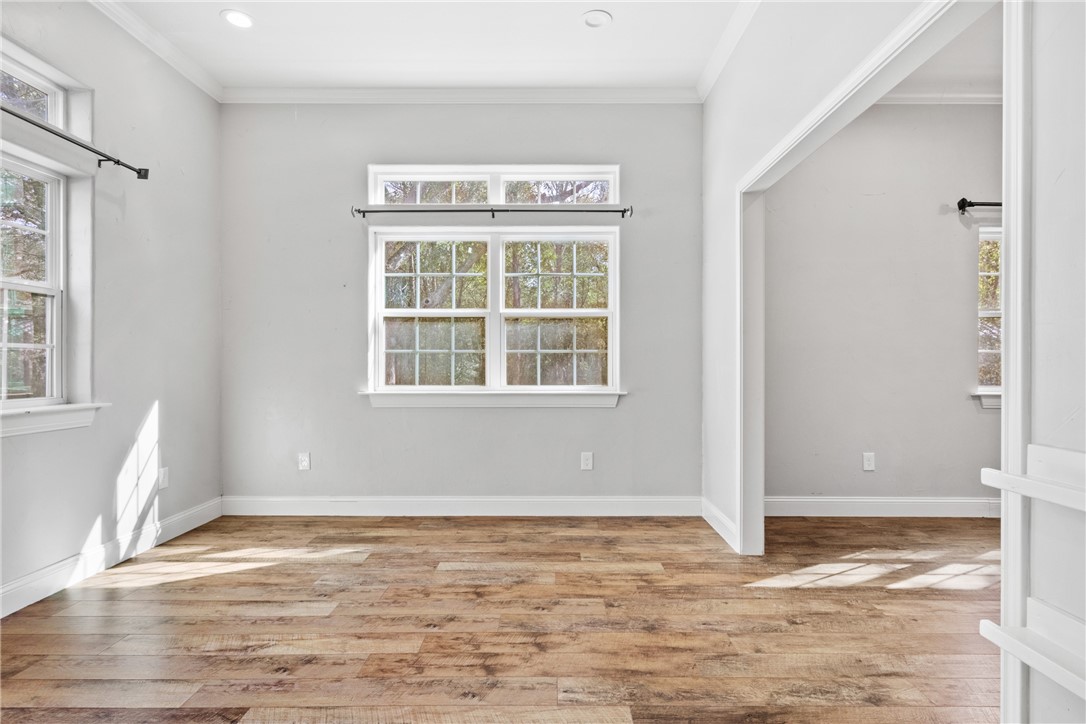 275 Woodruff Road Waco, TX 76705 - Photo 19 of 42 a view of an empty room with wooden floor and a window